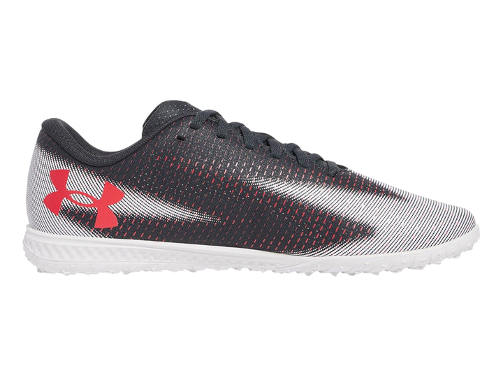 Zapato de fútbol Under Armour Shadow Select 3 Turf en color gris con suela blanca y detalles en rojo.