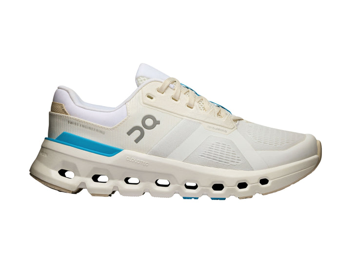 Tenis deportivos On Cloud color blanco con detalles en azul y suela con tecnología de amortiguación característica.