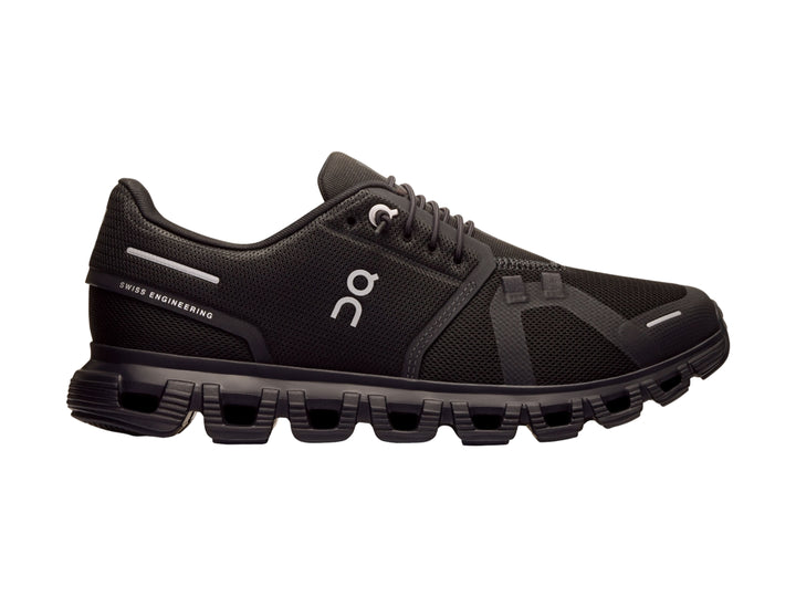 Tenis deportivos On Cloud color negro con suela amortiguada y malla transpirable.