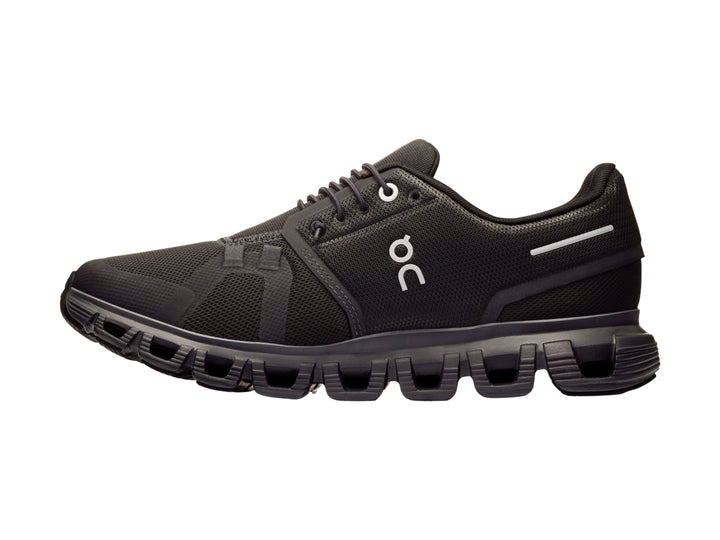 Tenis deportivos On Cloud color negro con suela amortiguada y malla transpirable.