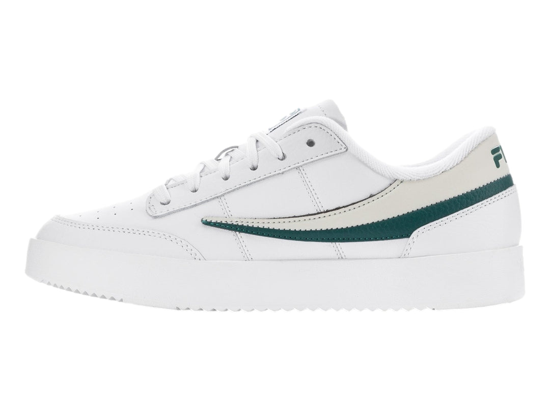 Tenis FILA blancos con franjas verde y beige, diseño deportivo de corte bajo.