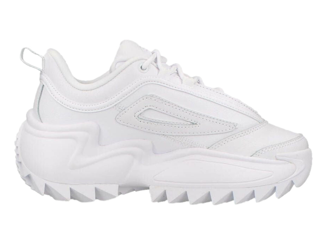 Tenis FILA Twister en color blanco total con suela gruesa y dentada de estilo deportivo moderno.