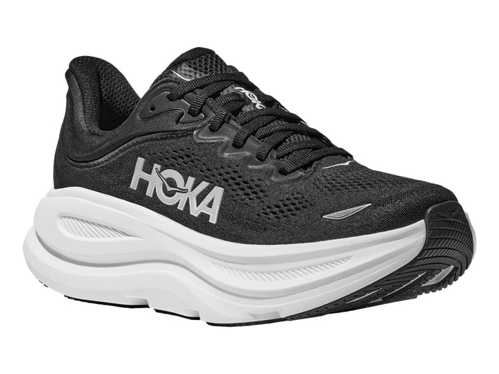 Tenis deportivos HOKA Bondi 9 en color negro con suela blanca ancha y logo lateral blanco.