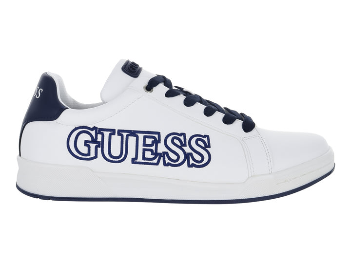 Tenis blancos de la marca Guess con detalles y logotipo en color azul, diseño casual y deportivo.