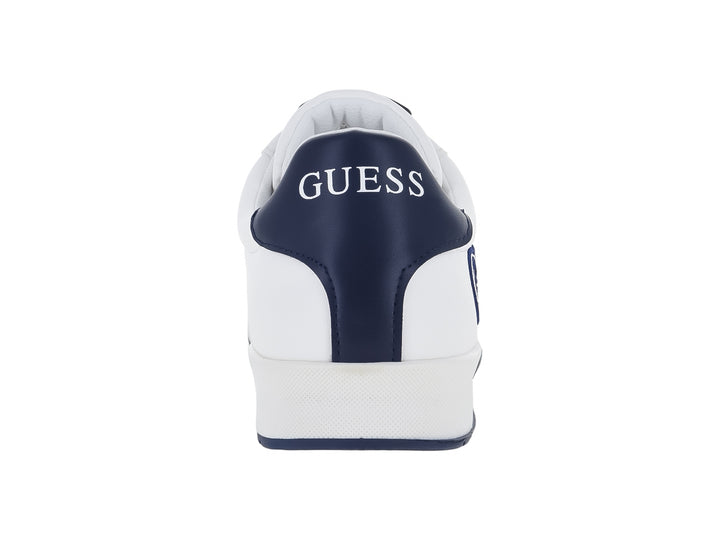 Tenis blancos de la marca Guess con detalles y logotipo en color azul, diseño casual y deportivo.
