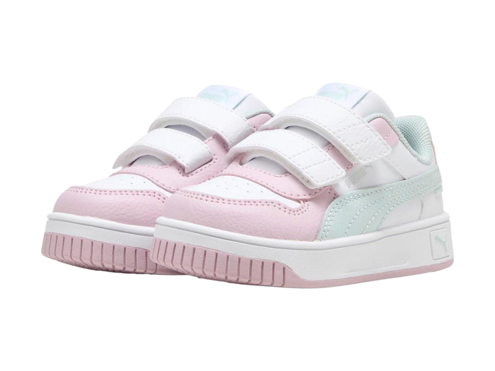 Tenis PUMA infantiles blancos y rosas con detalles en azul claro y cierre de velcro.
