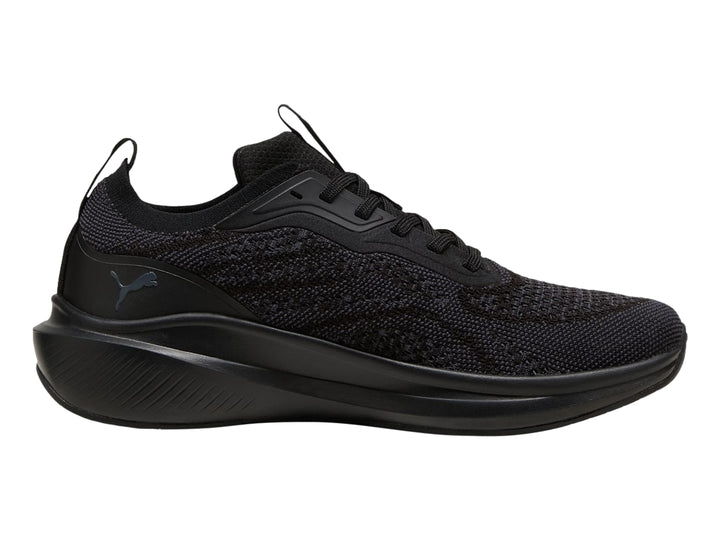 Tenis PUMA Skyrocket Lite en color negro y gris oscuro con tejido transpirable y suela deportiva.