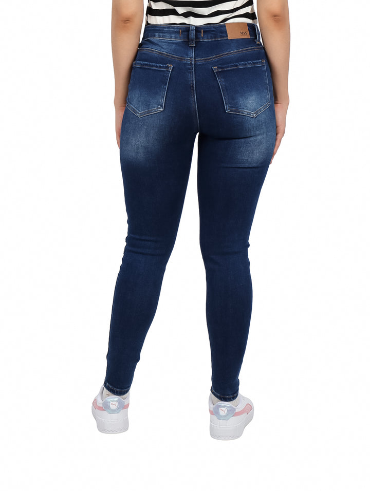 Jeans skinny color azul oscuro con efecto desgastado y roturas decorativas en las piernas.