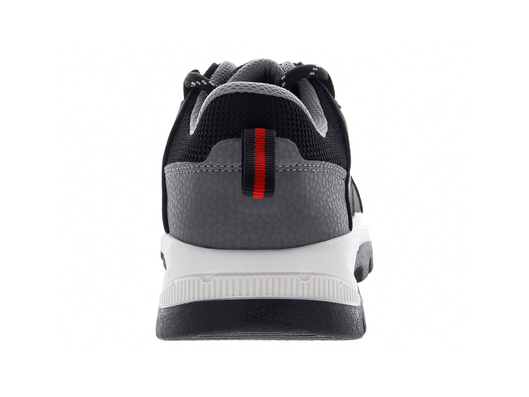 Botas infantiles Discovery color negro con suela blanca y detalles en gris, estilo deportivo y resistente.