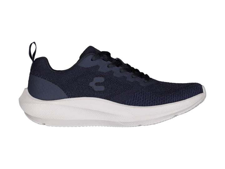 Tenis deportivos Charly color azul marino con suela blanca, vista lateral.
