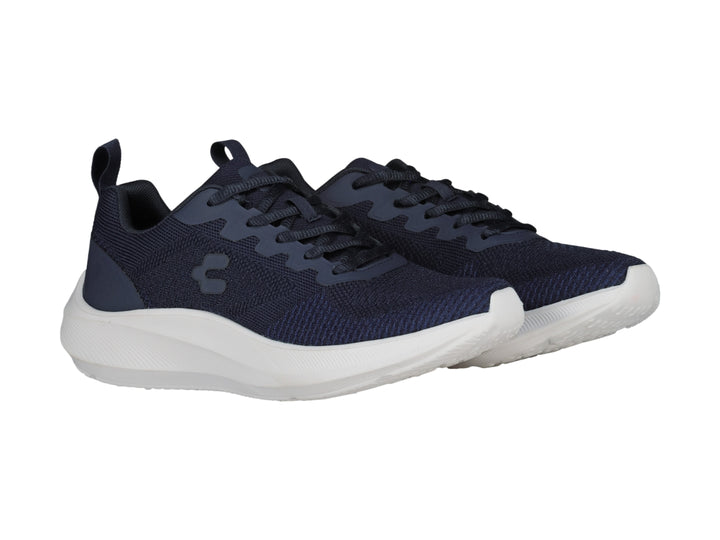Tenis deportivos Charly color azul marino con suela blanca, vista lateral.