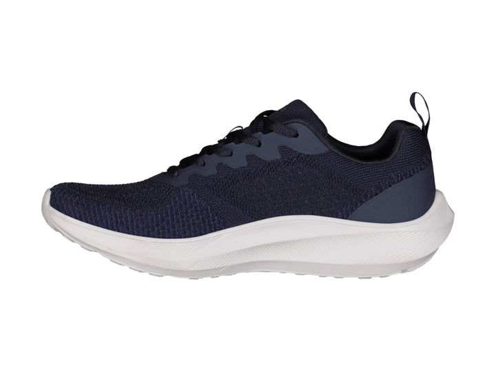 Tenis deportivos Charly color azul marino con suela blanca, vista lateral.