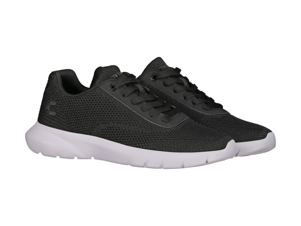 Tenis deportivos Charly color negro con suela blanca y tejido transpirable.