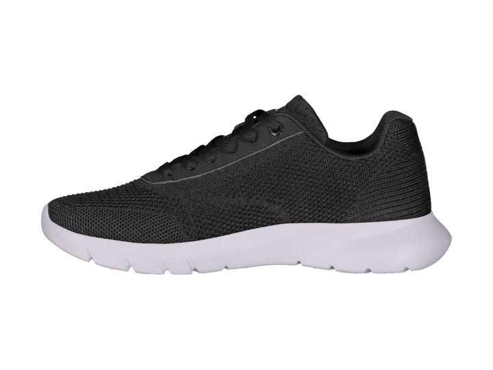 Tenis deportivos Charly color negro con suela blanca y tejido transpirable.