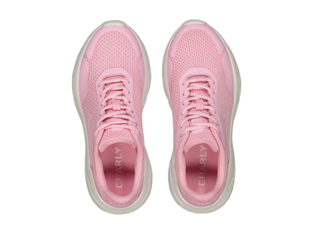 Tenis deportivos Charly color rosa con suela blanca y tejido transpirable.
