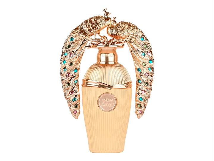 Perfume Lattafa Afeef dorado con tapa de pavo real ornamentada y su empaque.