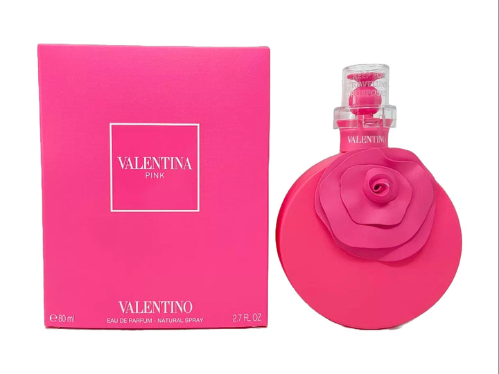 Perfume Valentino Pink de 80ml con frasco circular adornado con una rosa y su caja rectangular en color rosa.