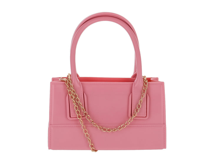 Bolso de mano color rosa pastel con diseño rectangular y asas cortas sobre fondo blanco.