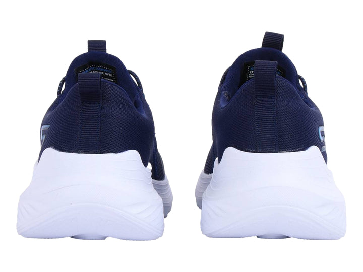 Tenis deportivos Skechers color azul marino con suela blanca y cordones elásticos.