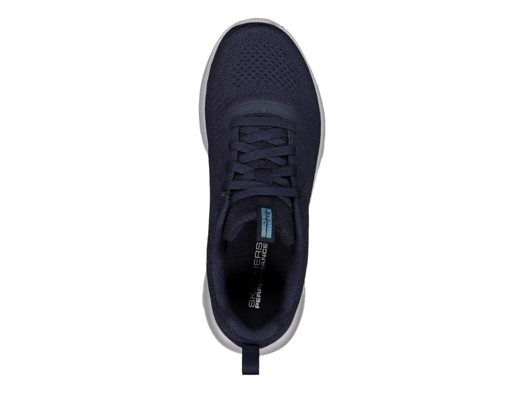 Tenis deportivos Skechers color azul marino con suela blanca y tejido transpirable.