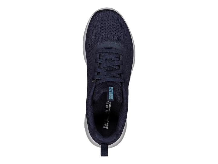 Tenis deportivos Skechers color azul marino con suela blanca y tejido transpirable.