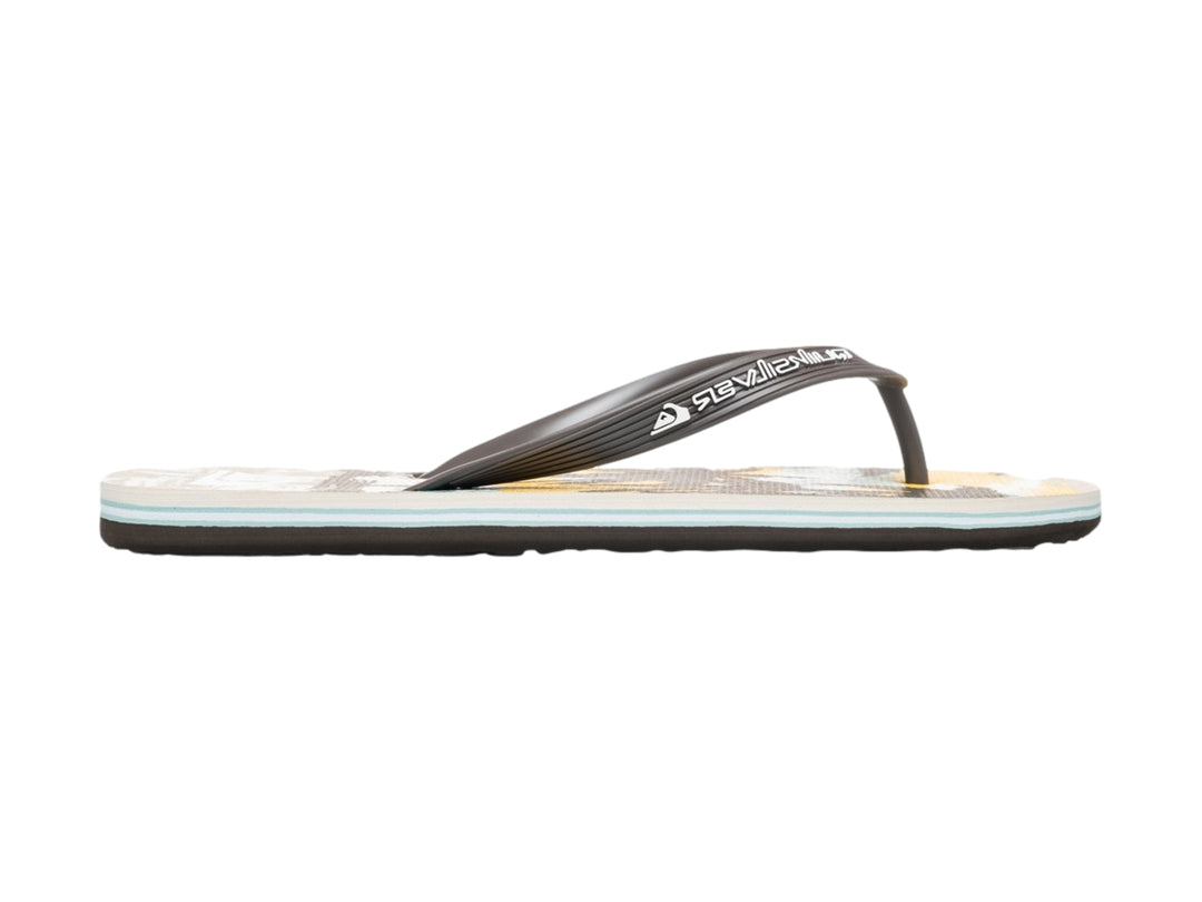 Sandalias Quiksilver de color blanco y negro con diseño tropical en la plantilla, vista lateral.