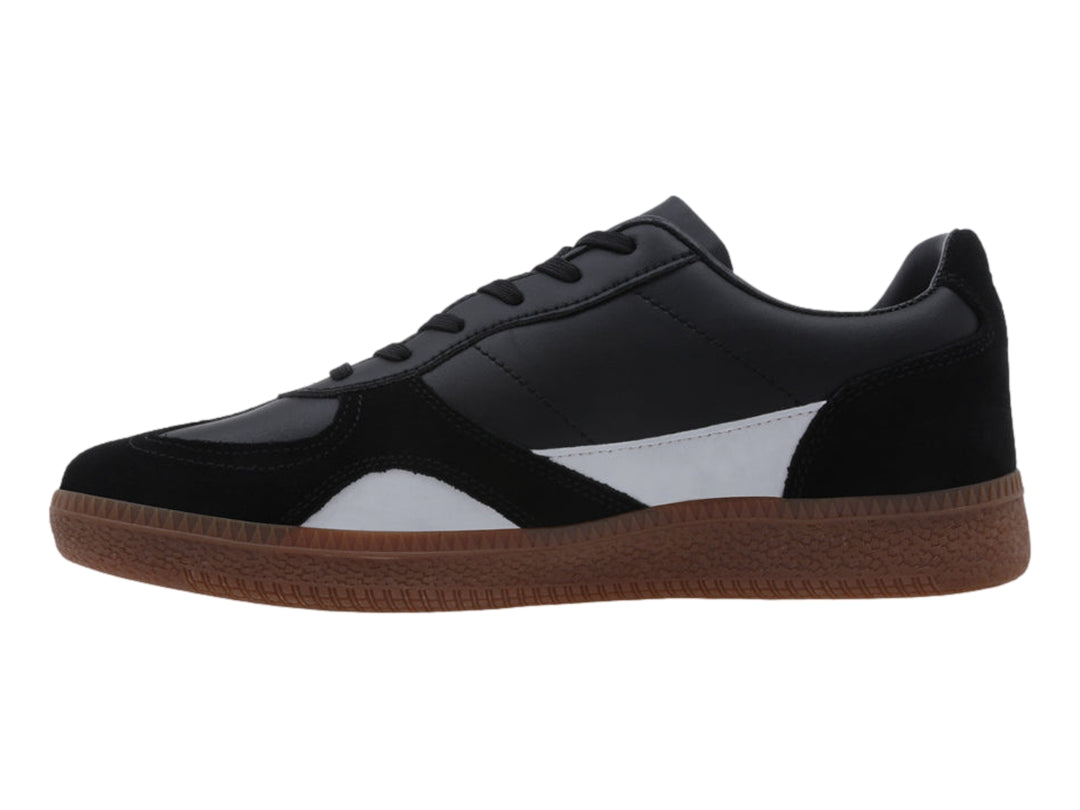 Tenis LOTTO negros con detalle blanco y suela de goma marrón.