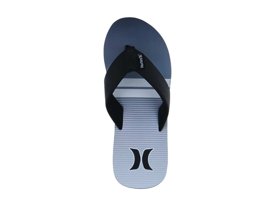 Sandalias Hurley modelo Freestone en colores blanco y negro con diseño plano y correa negra.