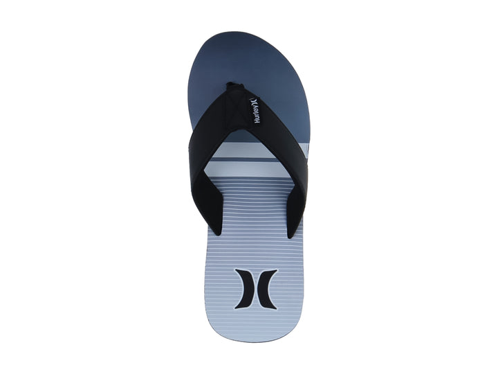 Sandalias Hurley modelo Freestone en colores blanco y negro con diseño plano y correa negra.
