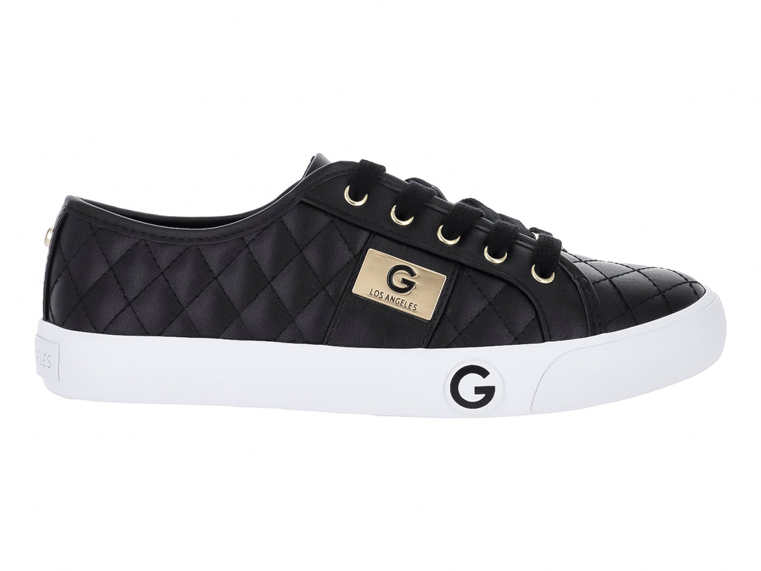 Tenis casuales GBG color negro con textura acolchada, detalles dorados y suela blanca.