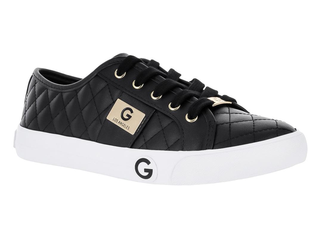Tenis casuales GBG color negro con textura acolchada, detalles dorados y suela blanca.