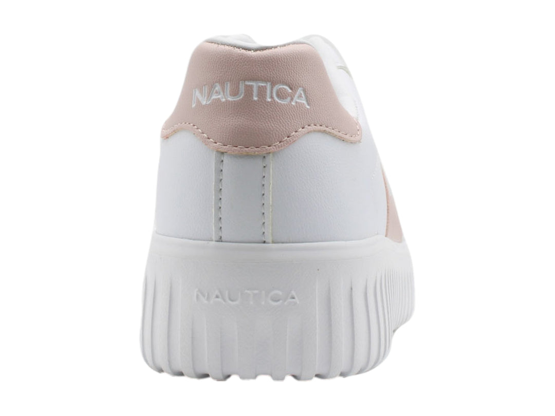 Tenis blancos de plataforma con detalle en color rosa palo y suela dentada.