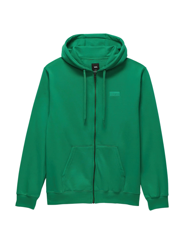 Hombre usando sudadera verde con capucha y cierre frontal de la marca Vans.