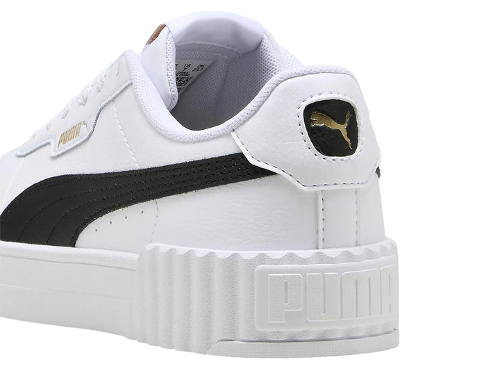 Tenis PUMA Carina 3.0 en color blanco con franja lateral negra y suela de plataforma blanca.