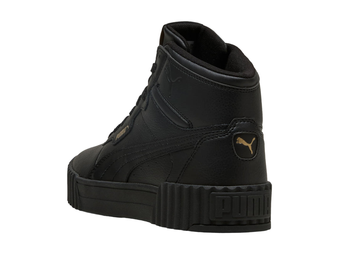 Tenis PUMA Carina 3.0 Mid en color negro con suela de plataforma y diseño de bota.
