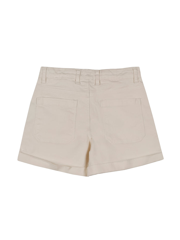 Shorts blancos para niña de la marca Zippy, estilo casual con bolsillos laterales.