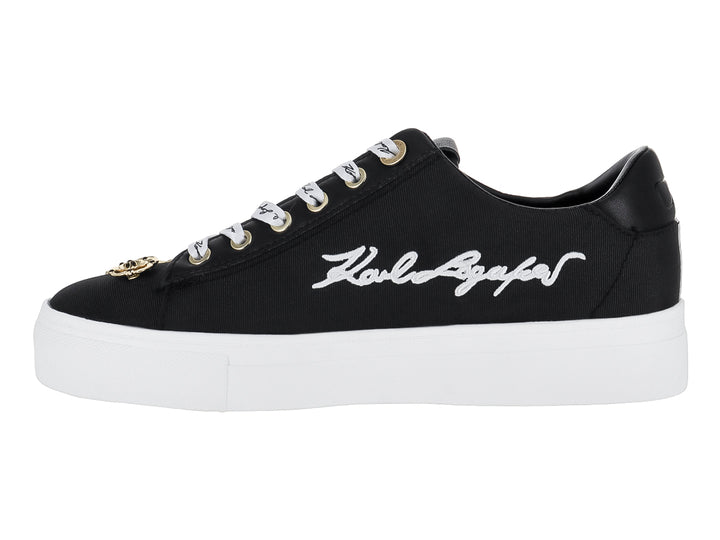 Tenis negros Karl Lagerfeld con suela blanca y pines decorativos dorados con texto Paris y Metro.