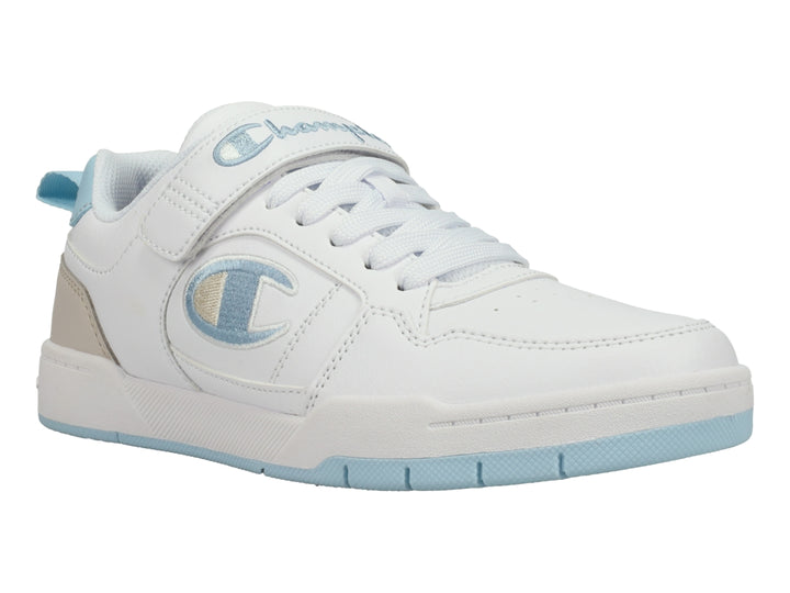 Tenis Champion blancos con detalles en azul cielo y beige, cierre de agujetas y correa de velcro.