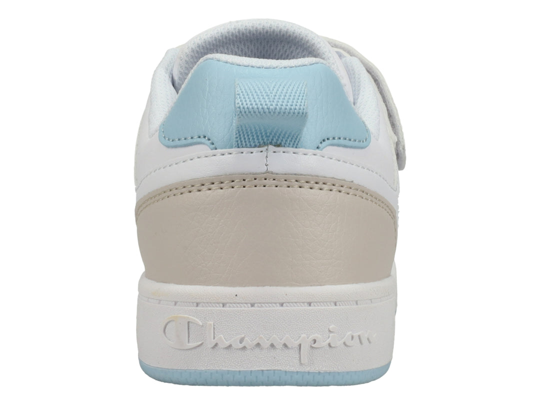 Tenis Champion blancos con detalles en azul cielo y beige, cierre de agujetas y correa de velcro.