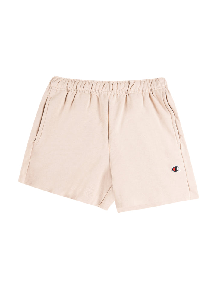 Pantalones cortos deportivos Champion en color champagne frost con cintura elástica y logo pequeño en la pierna.