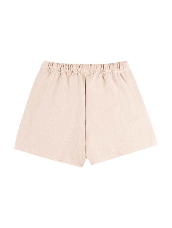 Pantalones cortos deportivos Champion en color champagne frost con cintura elástica y logo pequeño en la pierna.