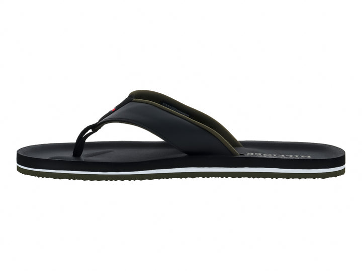 Sandalias de dedo negras Tommy Hilfiger con detalle blanco y verde en la suela.