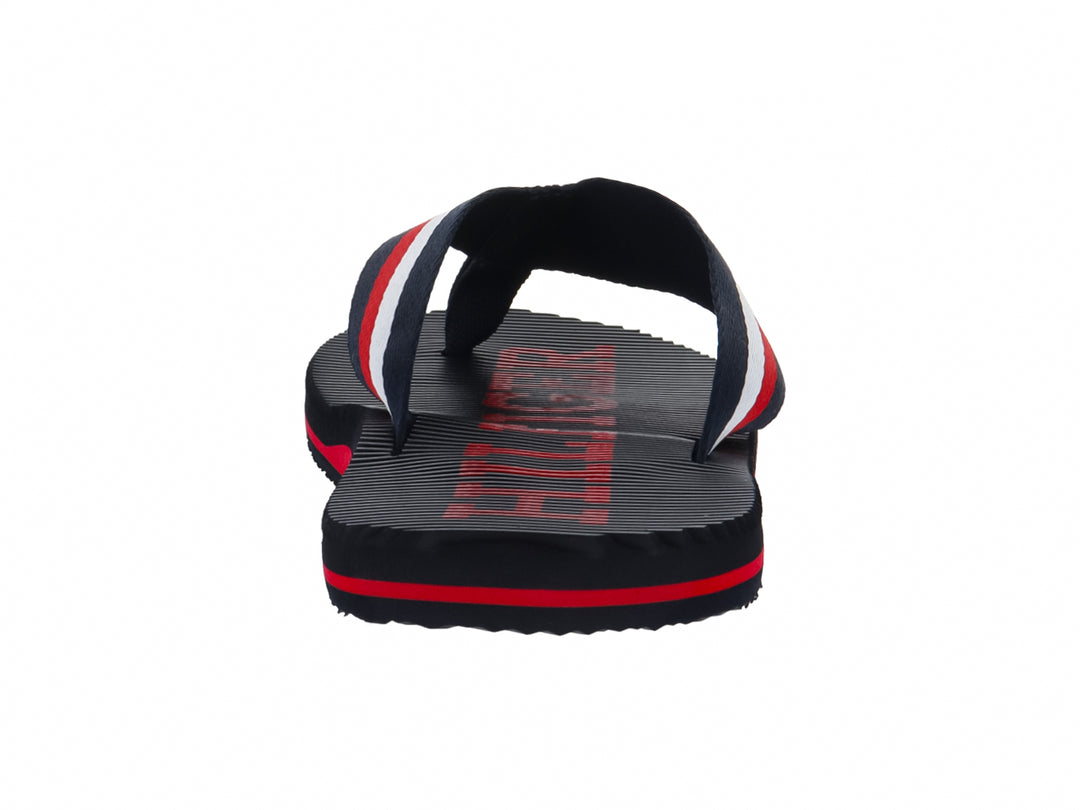 Sandalias Tommy Hilfiger azul marino con franjas rojas y blancas en la correa y la suela.