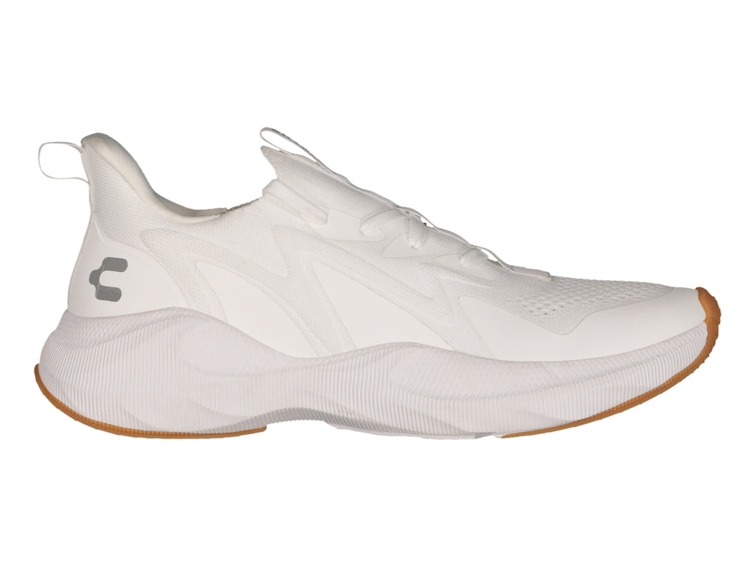 Tenis deportivos Charly color blanco con suela color café y detalles en relieve.