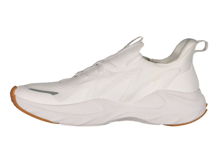 Tenis deportivos Charly color blanco con suela color café y detalles en relieve.