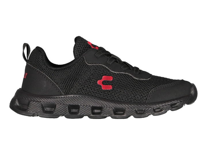 Zapato deportivo Charly para niño en color negro con detalles rojos y suela robusta.
