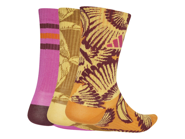 Set de tres pares de calcetines Adidas x Farm en colores fucsia, amarillo y naranja con estampados florales.