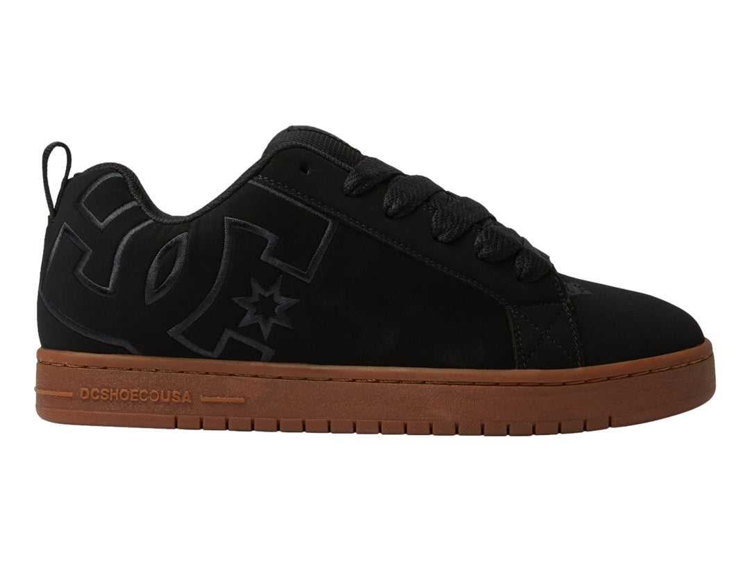 Tenis DC Shoes modelo Court Graffik en color negro con suela marrón tipo gum.