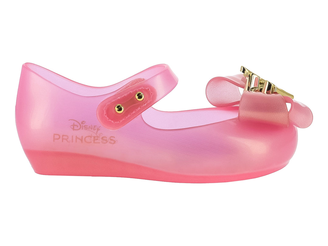Zapato Mary Jane rosa translúcido para niña con moño y detalles dorados de Disney Princess.