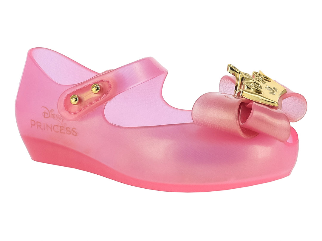 Zapato Mary Jane rosa translúcido para niña con moño y detalles dorados de Disney Princess.